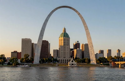 St. Louis Gateway Arch at golden hour with the Mississippi River and Illinois farmland in the background