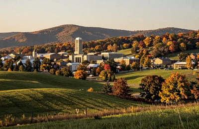 Morgantown West Virginia nestled in Appalachian hills with rolling farmland in the foreground
