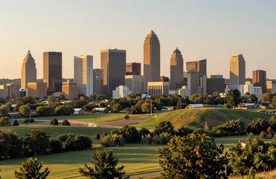 Birmingham Alabama skyline surrounded by green farmland hills at golden hour