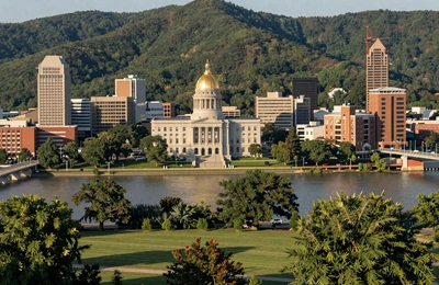 Charleston West Virginia along the Kanawha River with green Appalachian hills and farmland