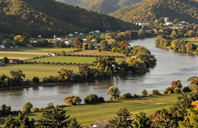 Huntington West Virginia along the Ohio River with green bottomland farms and Appalachian hills