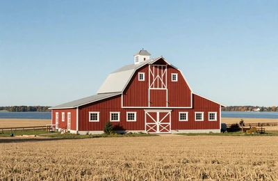 Scandinavian-style Minnesota farm with red barn and golden grain fields stretching toward a distant lake
